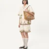 Bermudas de lona de algodón con bordados florales y ribetes jacquard Bermudas de lona de algodón con bordados florales y ribetes jacquard