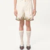 Bermudas de lona de algodón con bordados florales y ribetes jacquard Bermudas de lona de algodón con bordados florales y ribetes jacquard