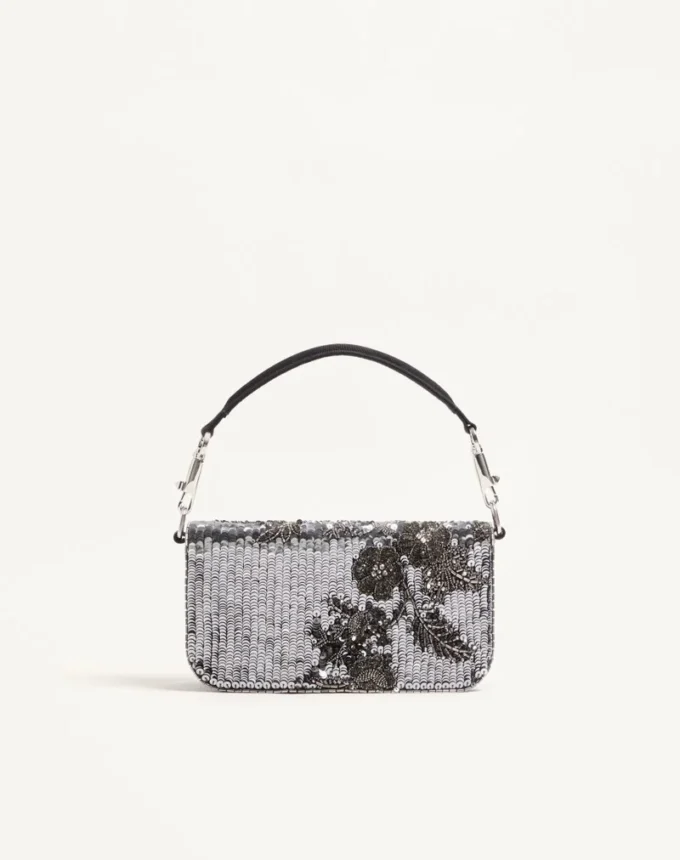 Bolso bandolera pequeño Locò de Valentino Garavani con bordado y logotipo joya Bolso bandolera pequeño Locò de Valentino Garavani con bordado y logotipo joya