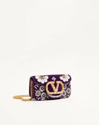Bolso bandolera pequeño Valentino Garavani Locò con logotipo bordado con joyas