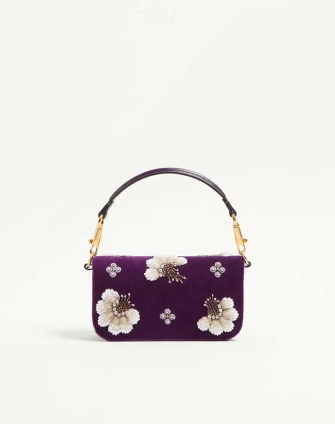 Bolso bandolera pequeño Valentino Garavani Locò con logotipo bordado con joyas Bolso bandolera pequeño Valentino Garavani Locò con logotipo bordado con joyas