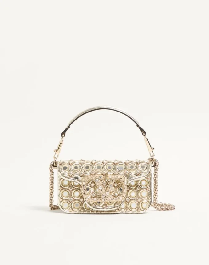 Bolso bandolera pequeño Valentino Garavani Locò con logotipo bordado con joyas Bolso bandolera pequeño Valentino Garavani Locò con logotipo bordado con joyas