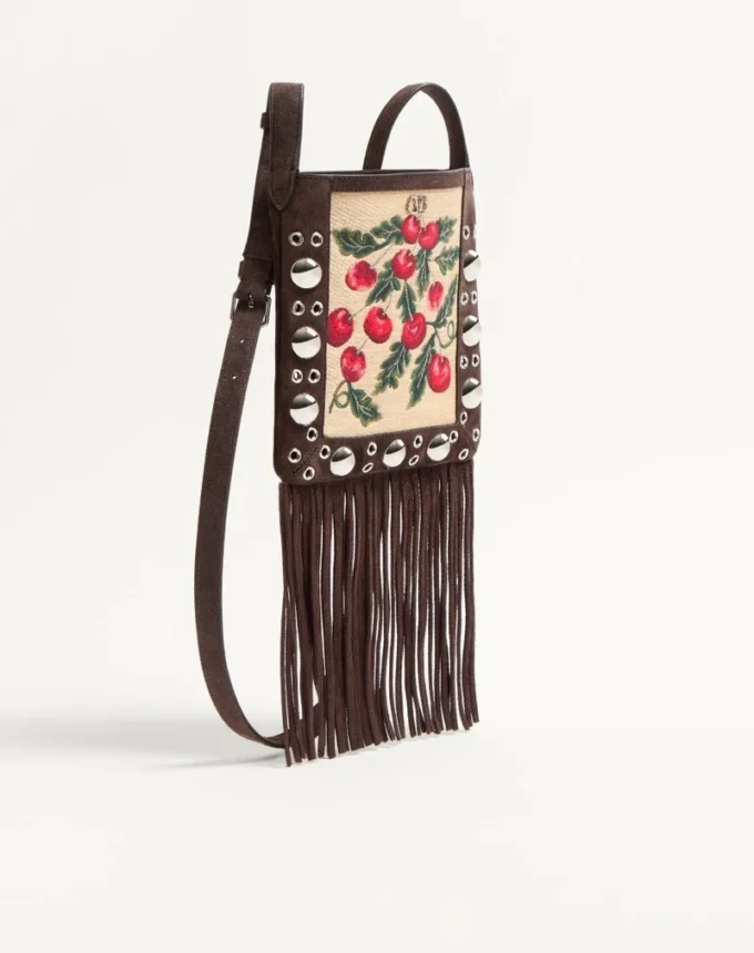 Bolso bandolera pequeño Valentino Garavani Nellcôte en rafia jacquard con estampado Cherryfic Bolso bandolera pequeño Valentino Garavani Nellcôte en rafia jacquard con estampado Cherryfic