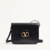 Bolso bandolera Valentino Garavani 9To5 de piel de becerro lisa Bolso bandolera Valentino Garavani 9To5 de piel de becerro lisa