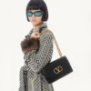 Bolso de hombro Valentino Garavani Vain en piel de becerro brillante Bolso de hombro Valentino Garavani Vain en piel de becerro brillante