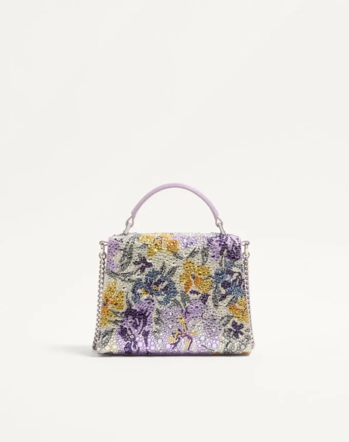 Bolso de mano mini Valentino Garavani Vsling con motivo Flowerism de pedrería y logotipo joya Bolso de mano mini Valentino Garavani Vsling con motivo Flowerism de pedrería y logotipo joya