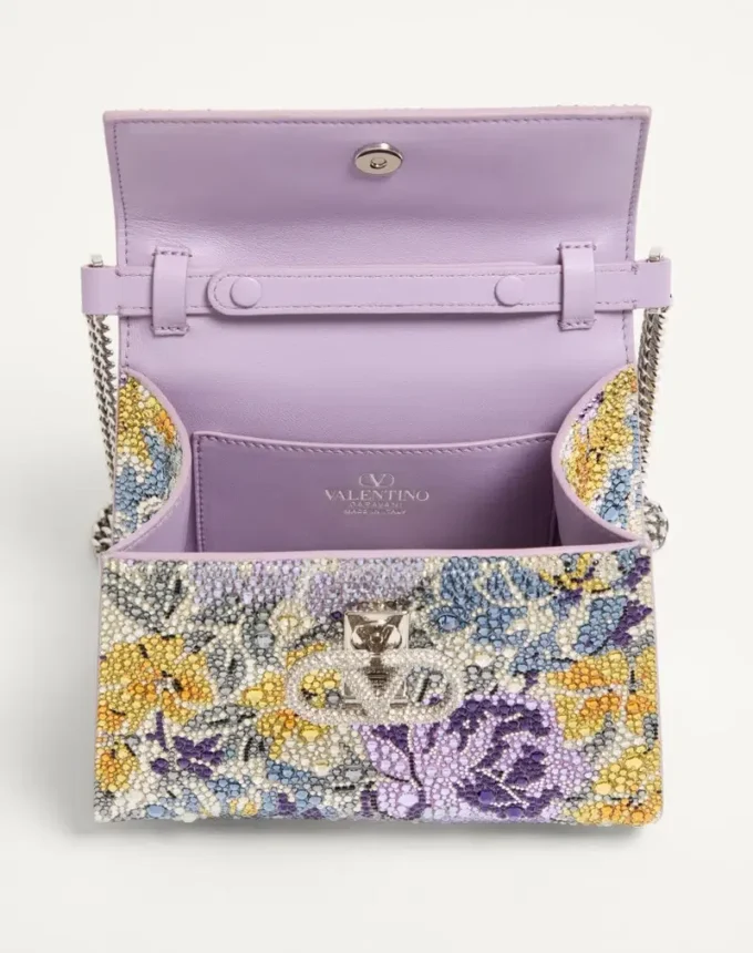 Bolso de mano mini Valentino Garavani Vsling con motivo Flowerism de pedrería y logotipo joya Bolso de mano mini Valentino Garavani Vsling con motivo Flowerism de pedrería y logotipo joya