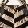 Bolso de mano Valentino Garavani Laseine en pitón y ante con estampado en forma de chevron