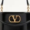 Bolso de tocador Valentino Garavani Vain en piel de becerro brillante Bolso de tocador Valentino Garavani Vain en piel de becerro brillante