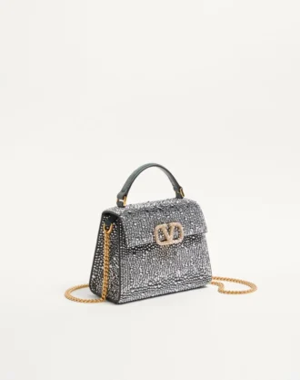 Bolso mini Vsling de Valentino Garavani con pedrería y logotipo joya