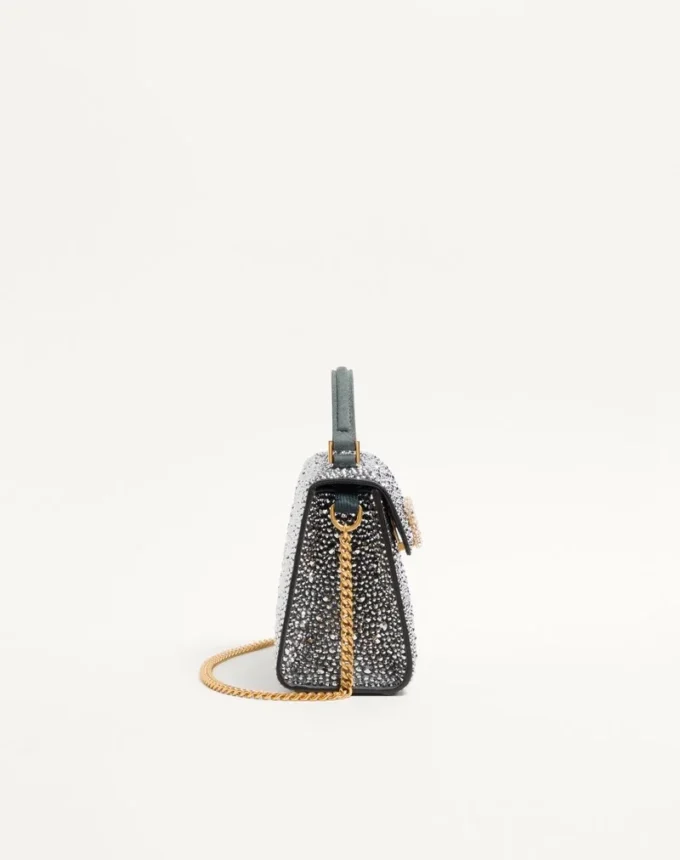 Bolso mini Vsling de Valentino Garavani con pedrería y logotipo joya Bolso mini Vsling de Valentino Garavani con pedrería y logotipo joya