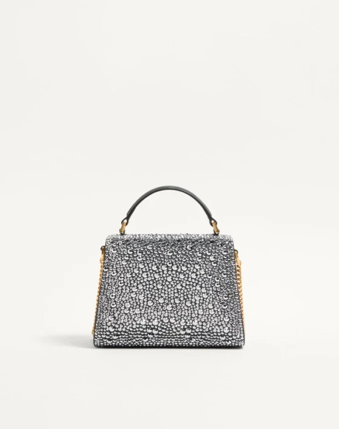 Bolso mini Vsling de Valentino Garavani con pedrería y logotipo joya Bolso mini Vsling de Valentino Garavani con pedrería y logotipo joya