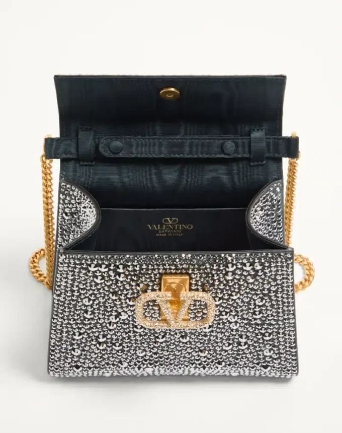 Bolso mini Vsling de Valentino Garavani con pedrería y logotipo joya Bolso mini Vsling de Valentino Garavani con pedrería y logotipo joya