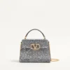 Bolso mini Vsling de Valentino Garavani con pedrería y logotipo joya Bolso mini Vsling de Valentino Garavani con pedrería y logotipo joya