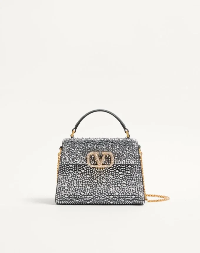 Bolso mini Vsling de Valentino Garavani con pedrería y logotipo joya Bolso mini Vsling de Valentino Garavani con pedrería y logotipo joya