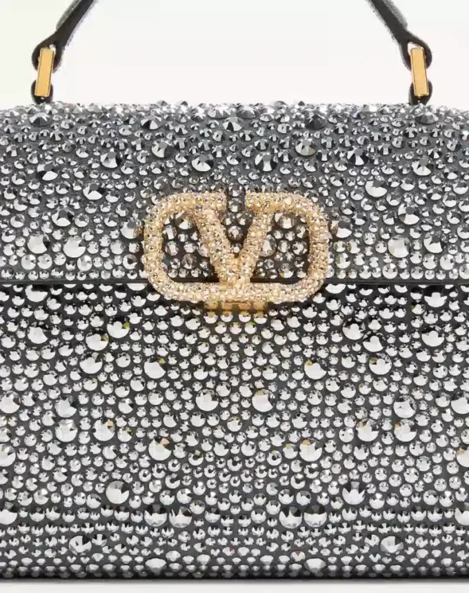 Bolso mini Vsling de Valentino Garavani con pedrería y logotipo joya Bolso mini Vsling de Valentino Garavani con pedrería y logotipo joya