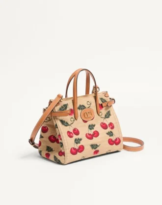 Bolso pequeño Antibes de Valentino Garavani en rafia jacquard con estampado Cherryfic