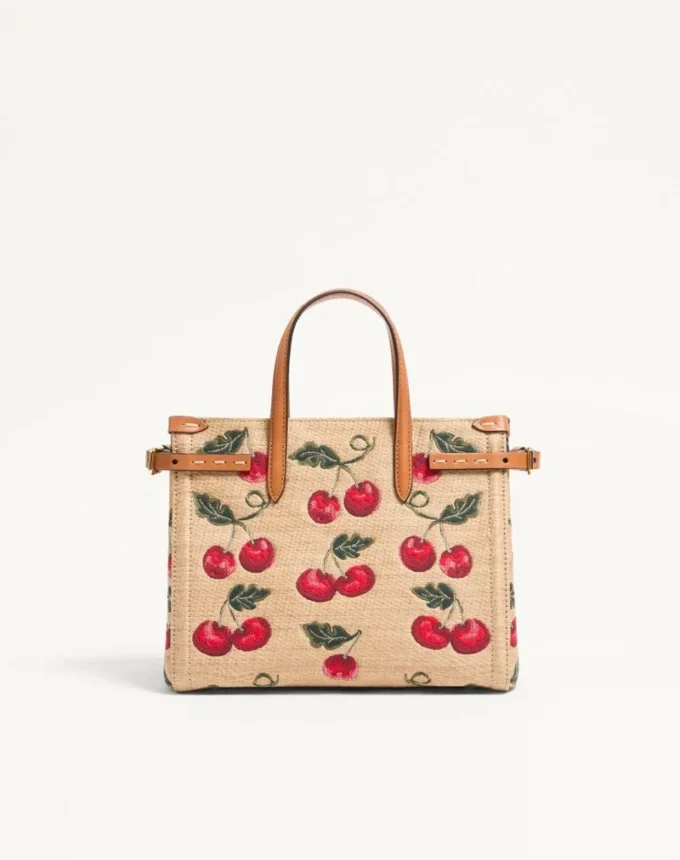 Bolso pequeño Antibes de Valentino Garavani en rafia jacquard con estampado Cherryfic Bolso pequeño Antibes de Valentino Garavani en rafia jacquard con estampado Cherryfic
