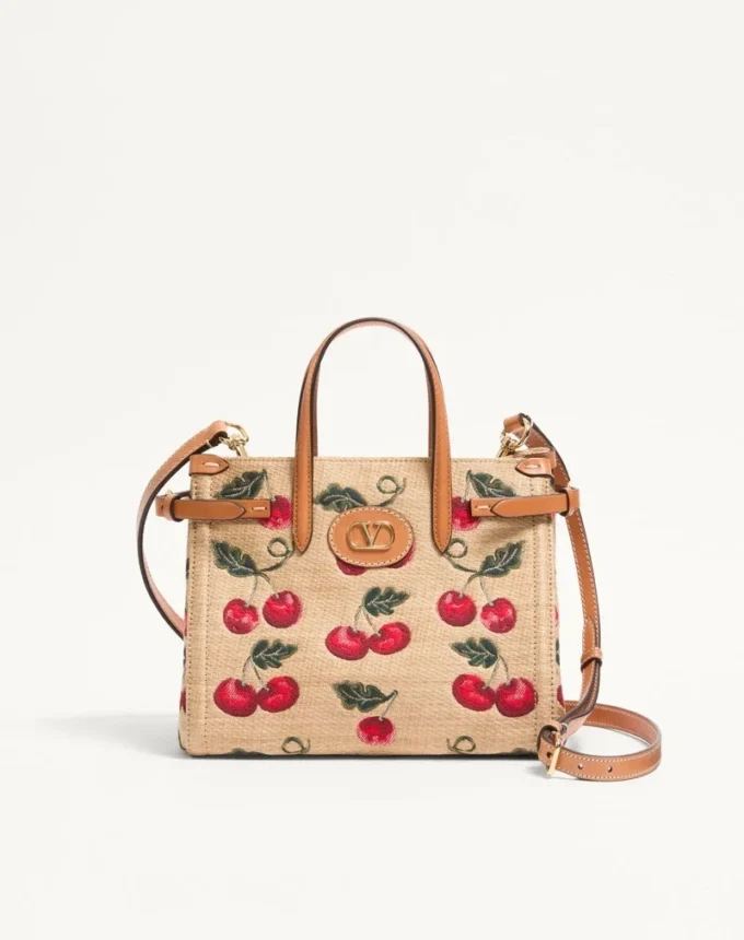Bolso pequeño Antibes de Valentino Garavani en rafia jacquard con estampado Cherryfic Bolso pequeño Antibes de Valentino Garavani en rafia jacquard con estampado Cherryfic
