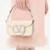 Bolso pequeño de hombro Valentino Garavani Locò con logotipo joya Bolso pequeño de hombro Valentino Garavani Locò con logotipo joya