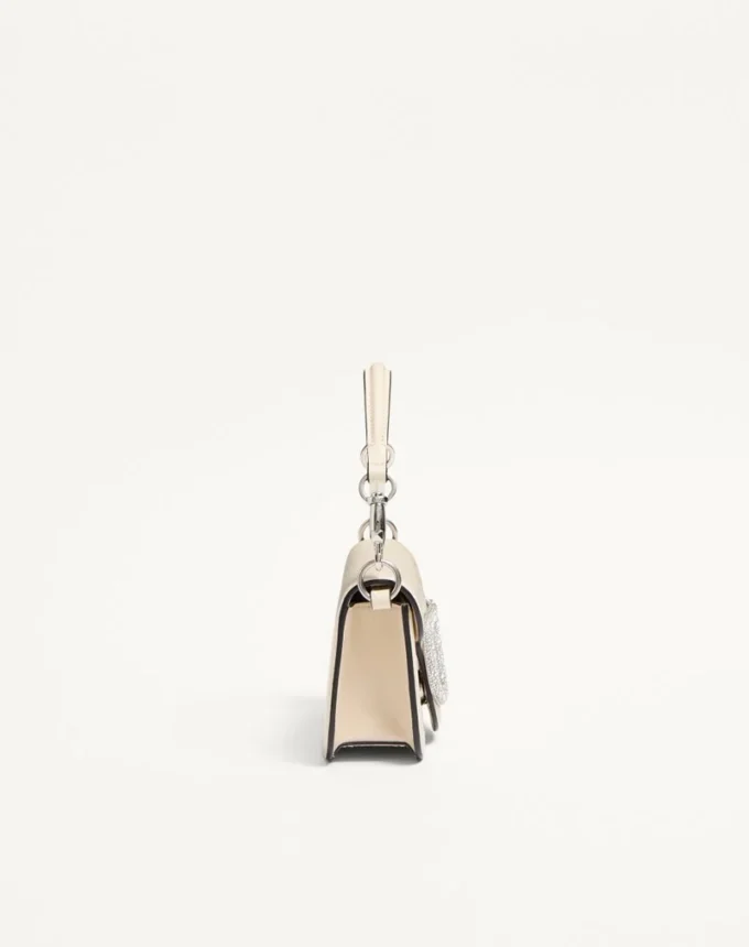 Bolso pequeño de hombro Valentino Garavani Locò con logotipo joya Bolso pequeño de hombro Valentino Garavani Locò con logotipo joya