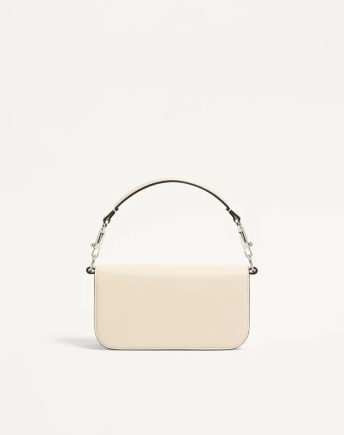 Bolso pequeño de hombro Valentino Garavani Locò con logotipo joya Bolso pequeño de hombro Valentino Garavani Locò con logotipo joya