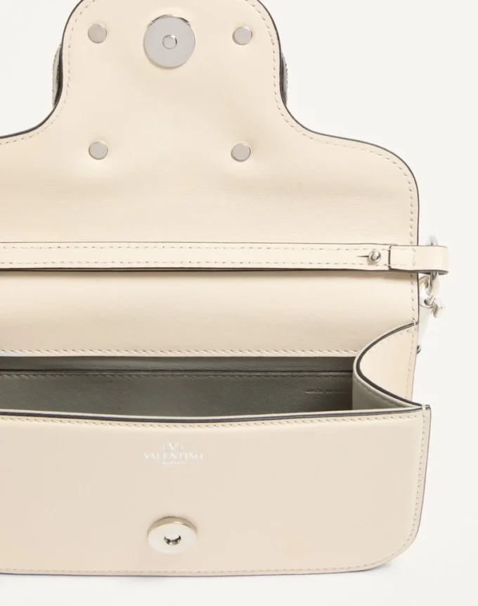 Bolso pequeño de hombro Valentino Garavani Locò con logotipo joya Bolso pequeño de hombro Valentino Garavani Locò con logotipo joya