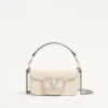 Bolso pequeño de hombro Valentino Garavani Locò con logotipo joya Bolso pequeño de hombro Valentino Garavani Locò con logotipo joya