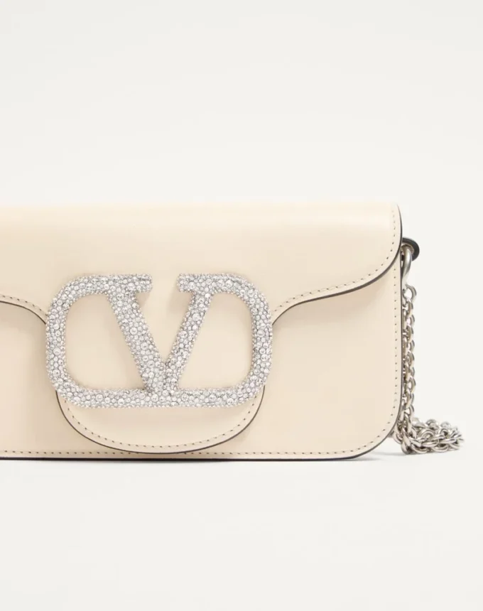 Bolso pequeño de hombro Valentino Garavani Locò con logotipo joya Bolso pequeño de hombro Valentino Garavani Locò con logotipo joya
