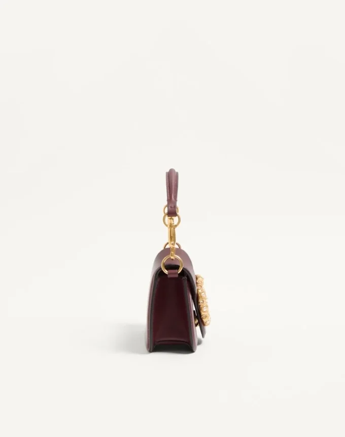 Bolso pequeño de hombro Valentino Garavani Locò en piel de becerro con logotipo Jewel