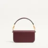 Bolso pequeño de hombro Valentino Garavani Locò en piel de becerro con logotipo Jewel