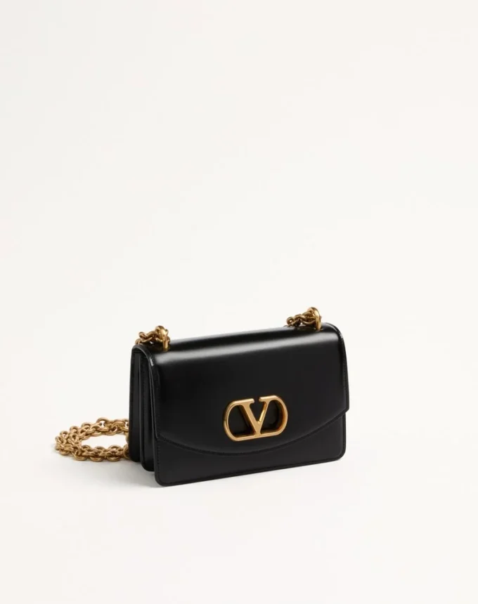 Bolso pequeño de hombro Valentino Garavani Vain en piel de becerro brillante Bolso pequeño de hombro Valentino Garavani Vain en piel de becerro brillante