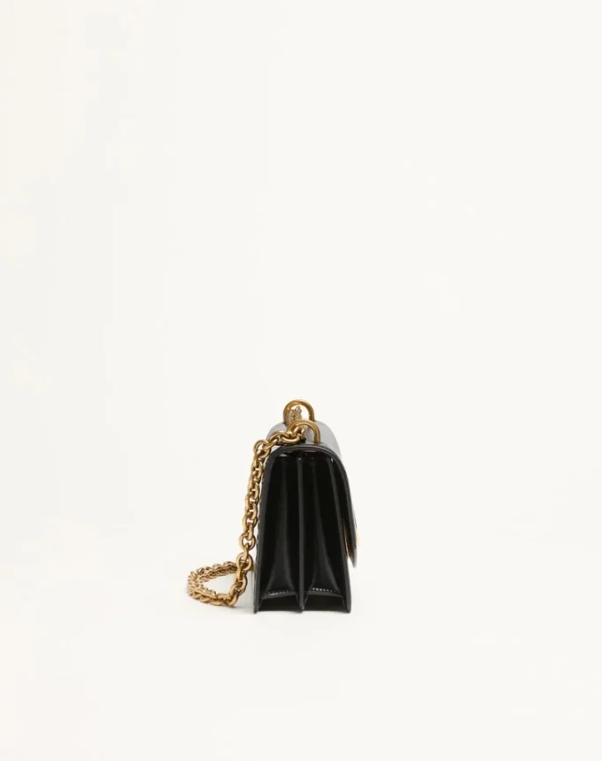 Bolso pequeño de hombro Valentino Garavani Vain en piel de becerro brillante Bolso pequeño de hombro Valentino Garavani Vain en piel de becerro brillante