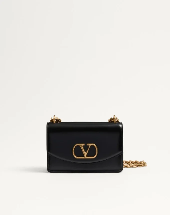 Bolso pequeño de hombro Valentino Garavani Vain en piel de becerro brillante Bolso pequeño de hombro Valentino Garavani Vain en piel de becerro brillante