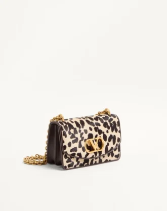 Bolso pequeño de hombro Valentino Garavani Vain en piel de becerro con efecto poni y estampado animalier