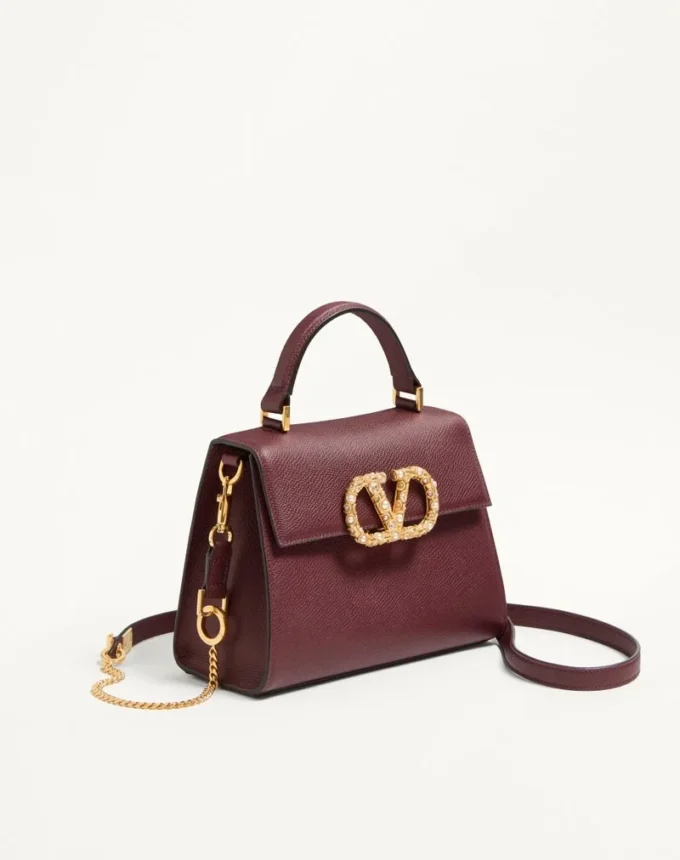 Bolso pequeño Valentino Garavani Vsling en piel de becerro granulada con logotipo joya