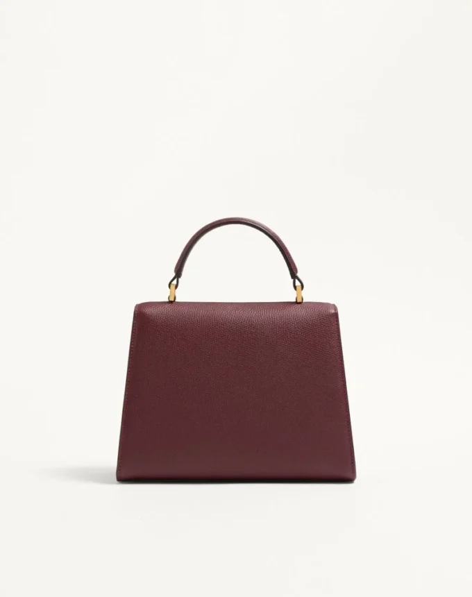 Bolso pequeño Valentino Garavani Vsling en piel de becerro granulada con logotipo joya