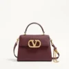 Bolso pequeño Valentino Garavani Vsling en piel de becerro granulada con logotipo joya