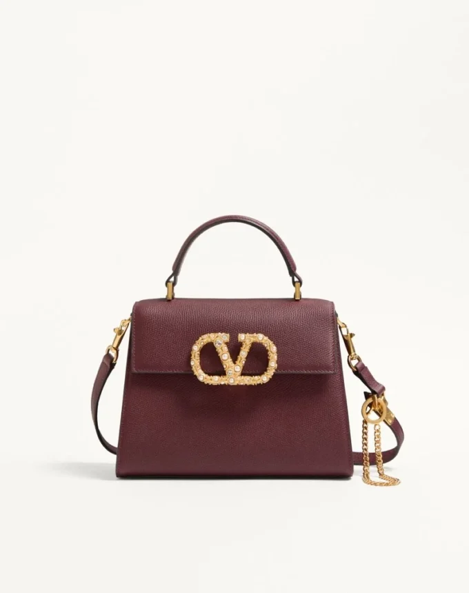 Bolso pequeño Valentino Garavani Vsling en piel de becerro granulada con logotipo joya