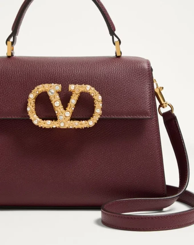 Bolso pequeño Valentino Garavani Vsling en piel de becerro granulada con logotipo joya