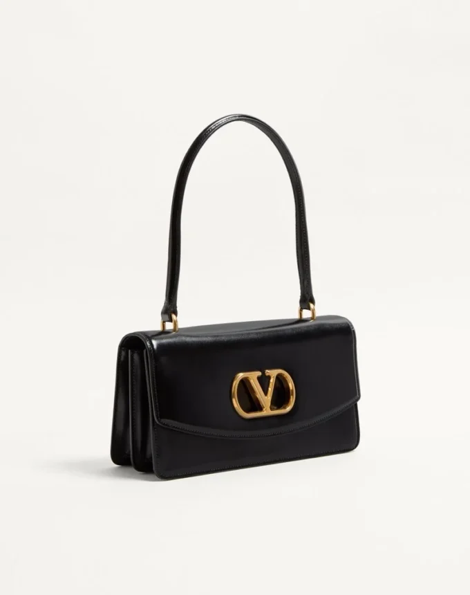 Bolso Valentino Garavani Vain con asa en piel de becerro brillante Bolso Valentino Garavani Vain con asa en piel de becerro brillante