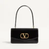 Bolso Valentino Garavani Vain con asa en piel de becerro brillante Bolso Valentino Garavani Vain con asa en piel de becerro brillante