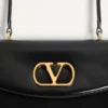 Bolso Valentino Garavani Vain con asa en piel de becerro brillante Bolso Valentino Garavani Vain con asa en piel de becerro brillante