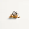 Broche Fleur Lumineuse de metal y tela