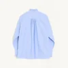 Camisa de algodón con plastrón y volantes Camisa de algodón con plastrón y volantes