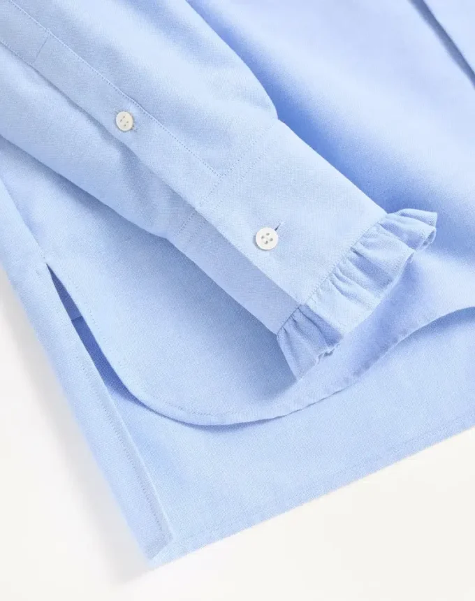 Camisa de algodón con plastrón y volantes Camisa de algodón con plastrón y volantes