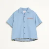 Camisa de denim con ribete estampado floral Camisa de denim con ribete estampado floral