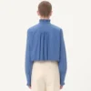 Camisa de popelín de algodón con plastrón y volantes Camisa de popelín de algodón con plastrón y volantes