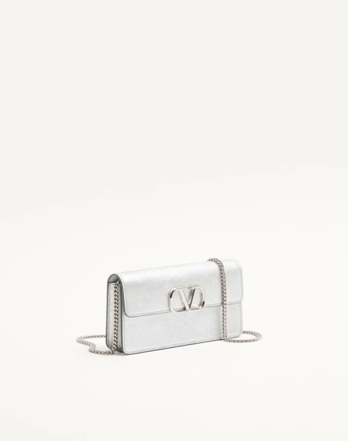 Cartera Vlogo Signature de piel de becerro granulada metalizada con cadena