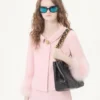 Chaqueta de crepé couture con plumas Chaqueta de crepé couture con plumas